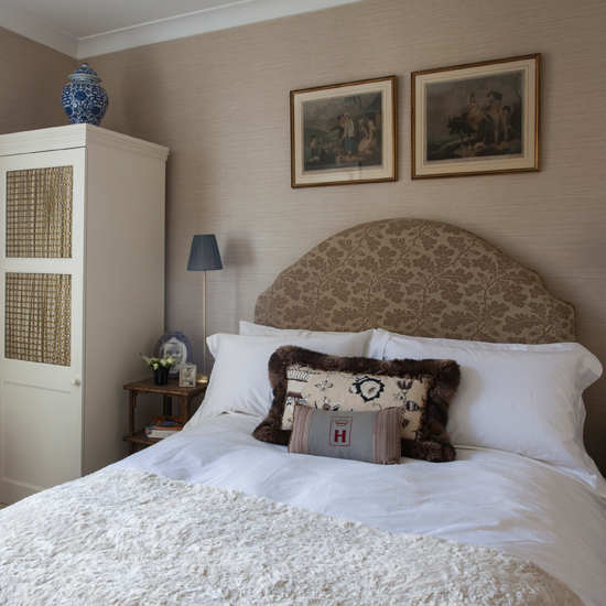 Neutral bedroom with patterned headboard