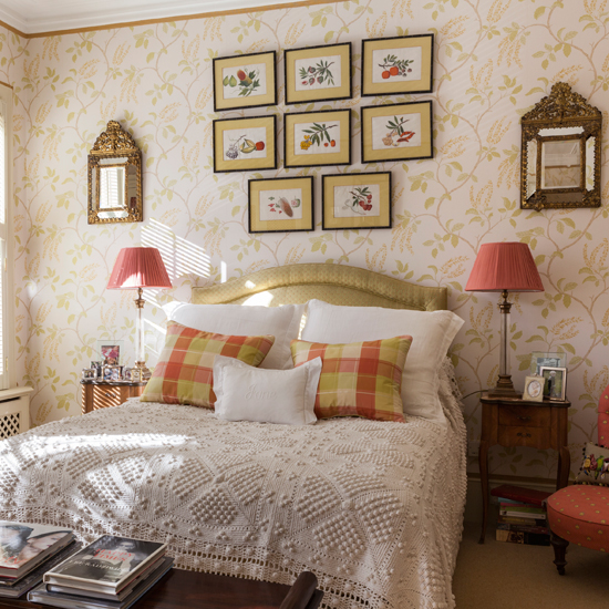 Gold bedroom with printed wallpaper