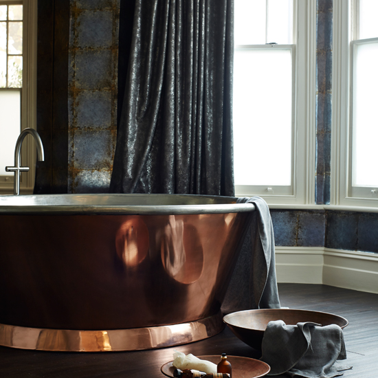 Modern bathroom with copper bath