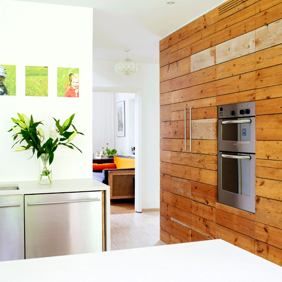 White kitchen with wood panelled wall