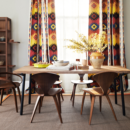 Dining room with wood furniture and colourful curtains | dining room decorating ideas