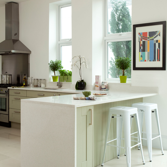 White and pale green kitchen peninsula