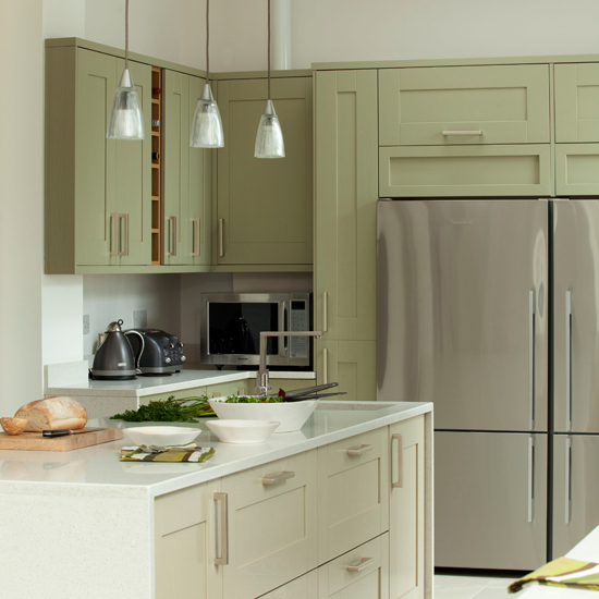 Green and white kitchen with fridge-freezer