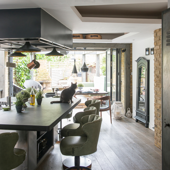 Green and dark wood kitchen-diner