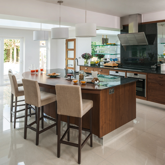 Glass and walnut kitchen with breakfast bar