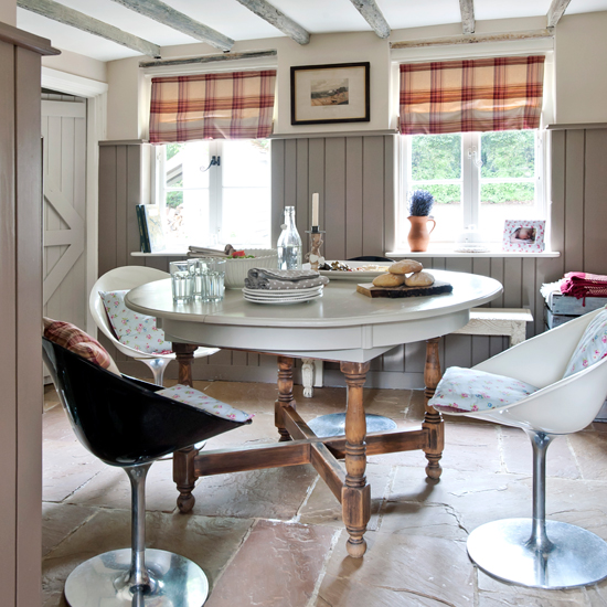 Period-style dining room with round table