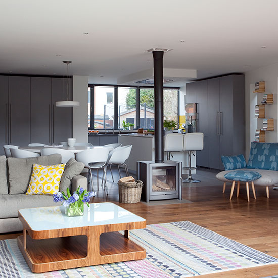 Retro grey and white kitchen-diner with wood burning stove ...