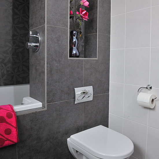 Bathroom with grey tiles and pink accents | Bathroom decorating ...