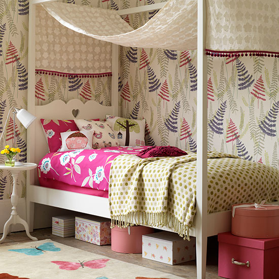 Girl's bedroom with canopy, themed wallpaper and butterfly rug 
