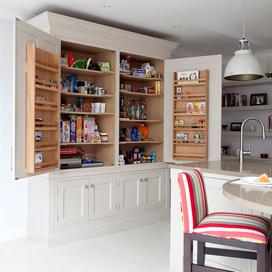 Pale grey kitchen with Shaker-style larder cupboard