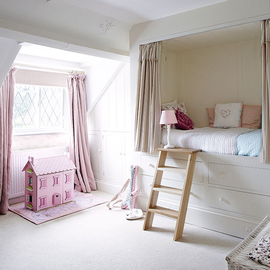 Girl's bedroom in white and pink with boxed-in bed