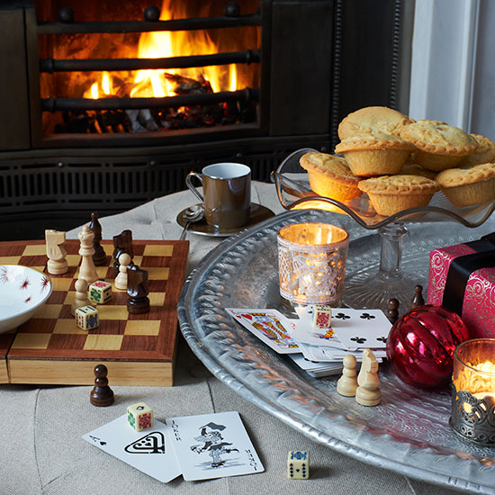 Country Christmas living room with fireplace, Christmas games and zinc tray