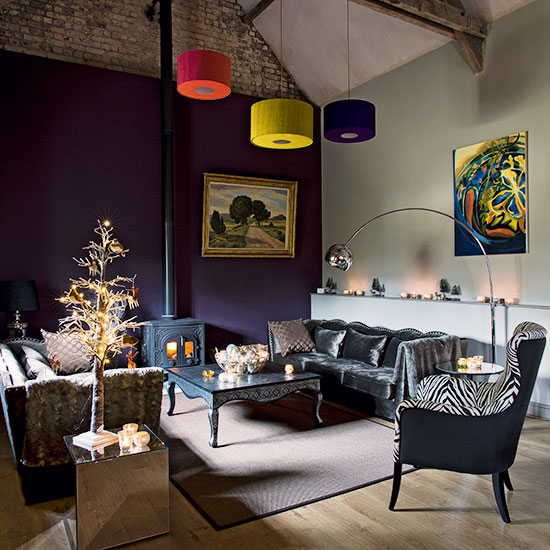 Purple living room with grey velvet sofa