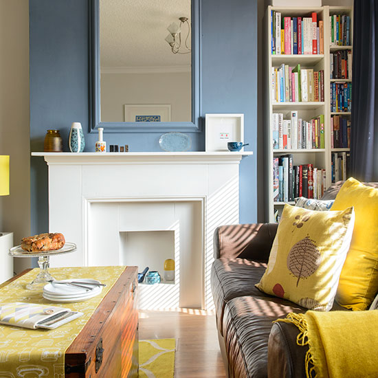 Blue and yellow living room with printed fabrics