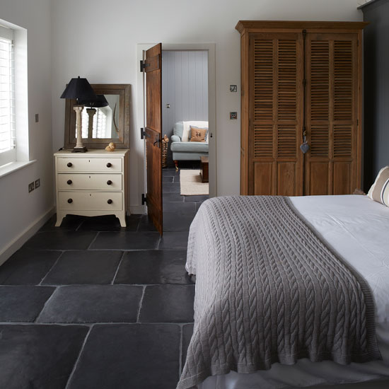 Neutral guest bedroom with grey slate floor | West Sussex country house | House tour | PHOTO GALLERY | Country Homes and Interiors | Housetohome.co.uk