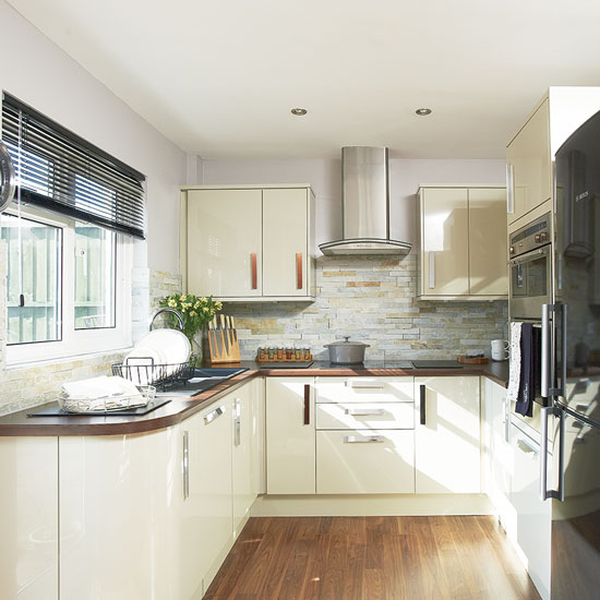 Cream gloss kitchen | Where and why laminate flooring can work for you