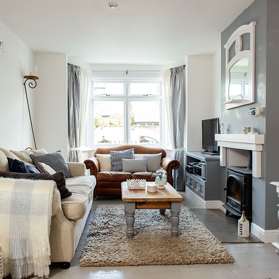 Grey living room with feature fireplace and cosy textures | Grey living