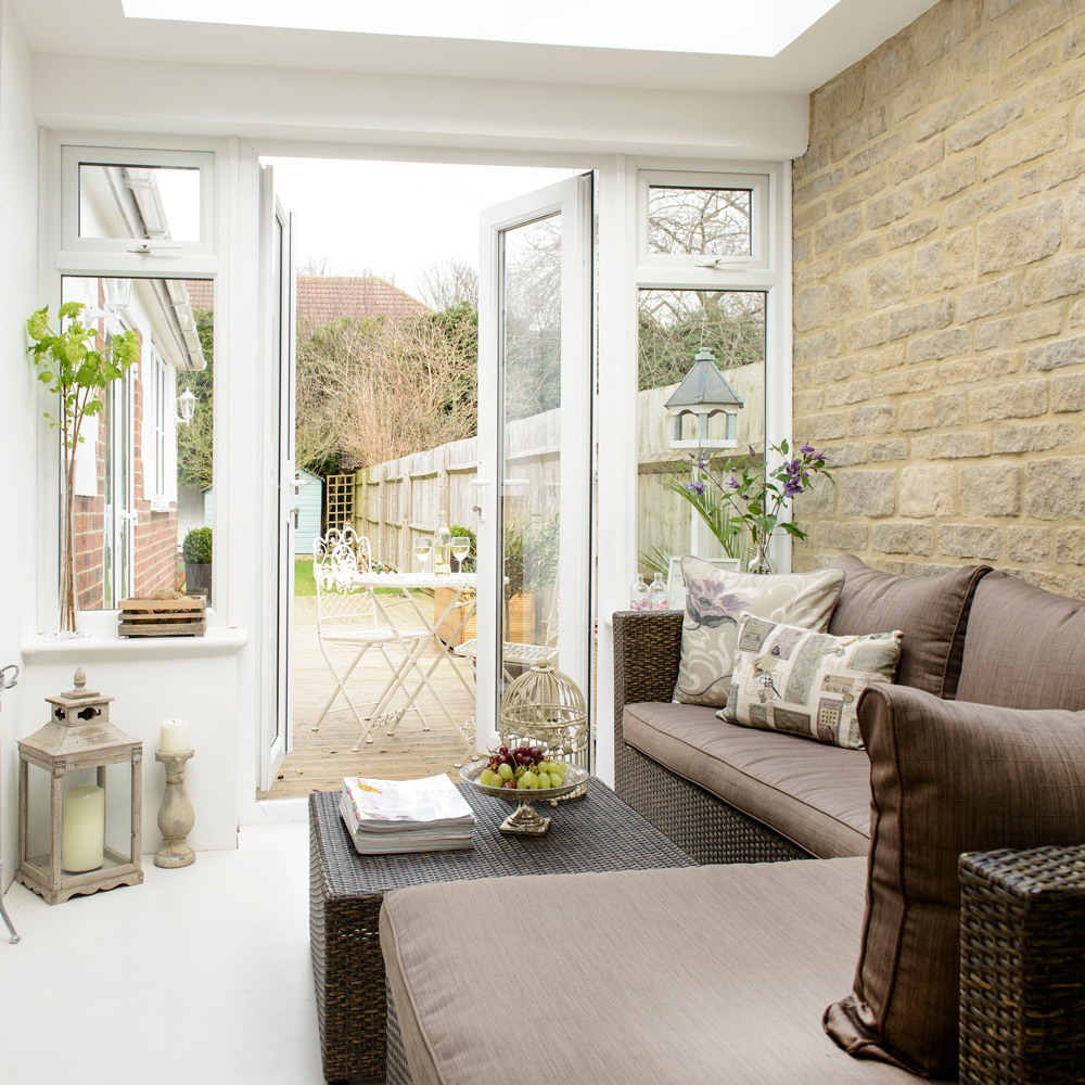 Compact conservatory with corner sofa